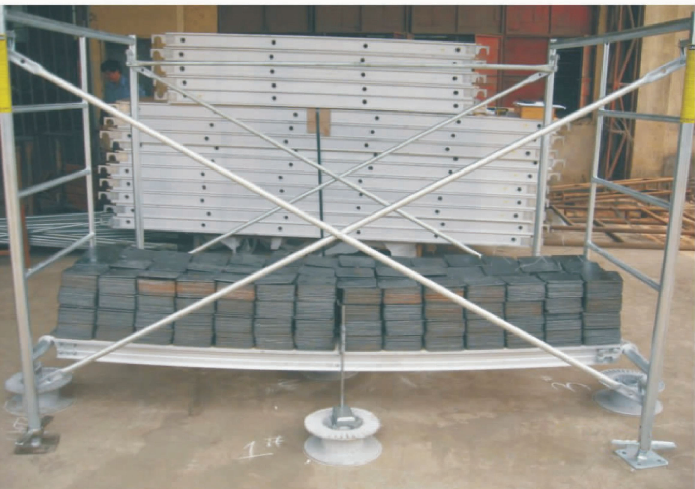 Load test of a 7′ × 19″ aluminum and wooden plank, photograph from the company catalogue